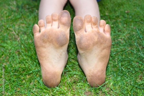 Dirty kids bare feet