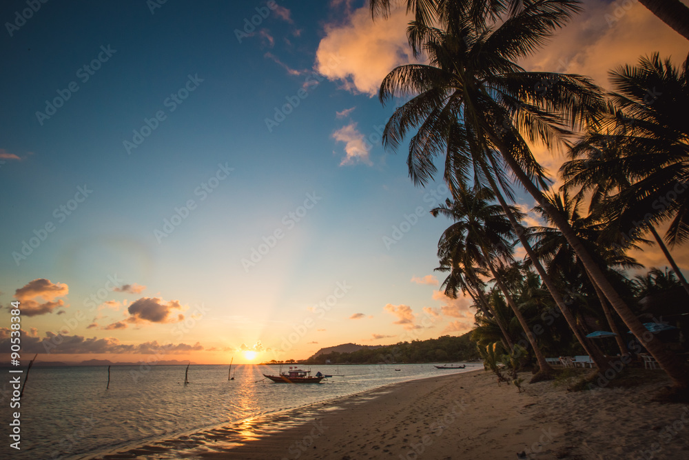 Fototapeta premium Sunset over the tropical beach. 