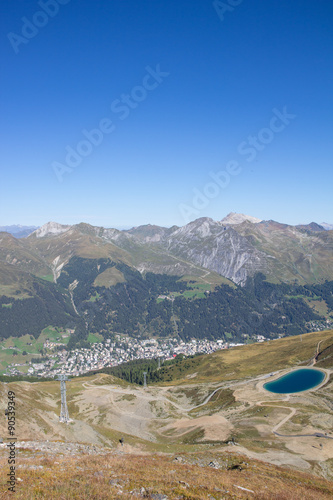 View To Davos From Mt. Jakobshorn With Water Reservoir Lake In Graubünden Switzerland In Summer photo