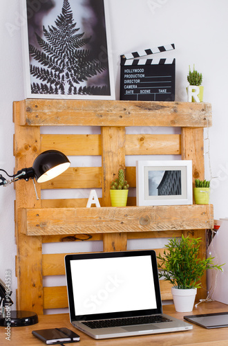 DIY workspace make with pallet. Computer blank on the desk