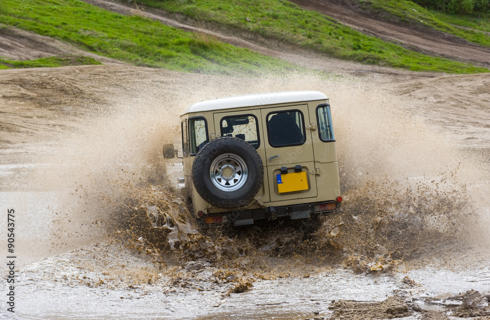 Four wheel drive on muddy track Four wheel drive on muddy track