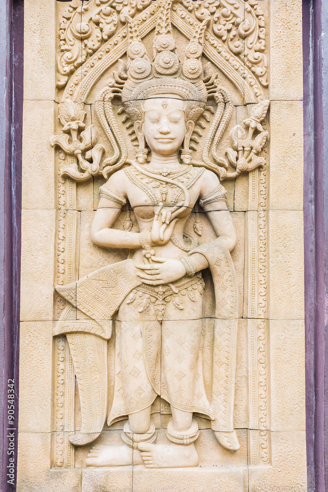 Apsara carvings statue on the wall of Cambodian art