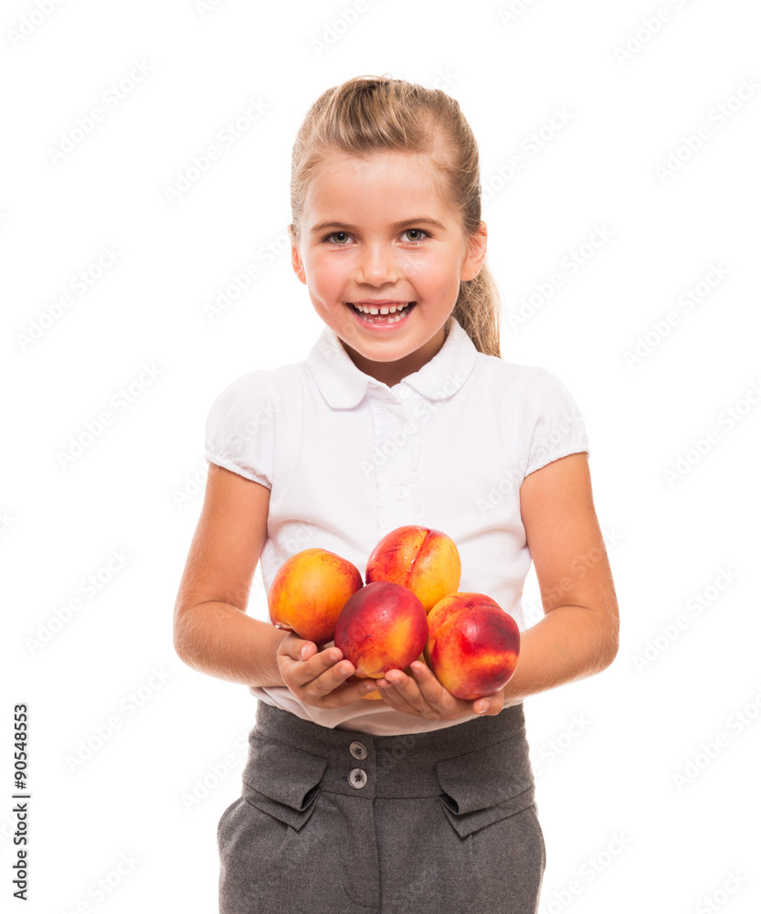 little girl standing against white backdrop with few fresh necta little girl standing against white backdrop with few fresh necta