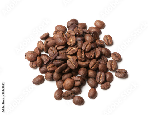 heap of roasted coffee beans on white