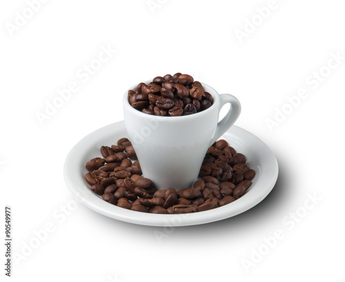 little cup filled with coffee beans on saucer