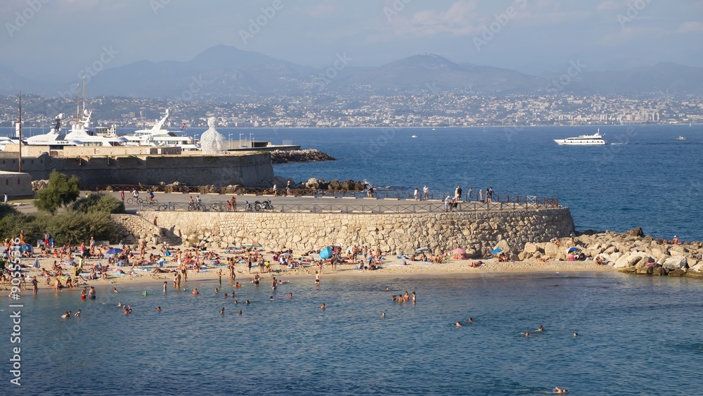 France, Antibes - August 28: Warm sea beach busy day in Antibes