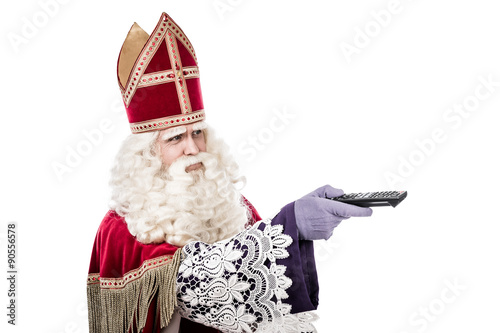 St. Nicholas holding remote on white background photo