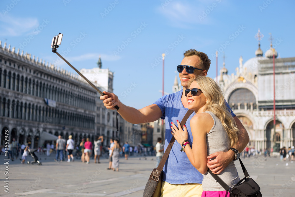 Naklejka premium Couple making selfie photo