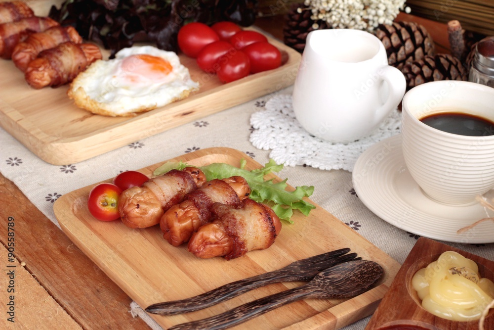 Grilled sausages wrapped in bacon fat of delicious. Grilled sausages wrapped in bacon fat of delicious.