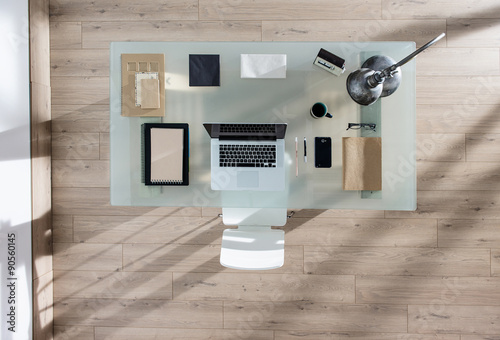 Картината върху платно top view of a perfectly tidy glass desk