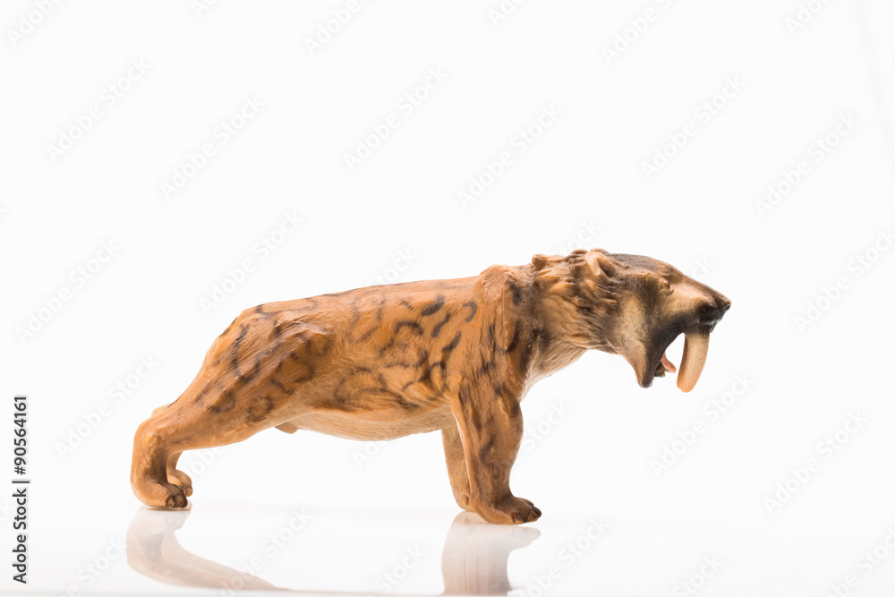 toy saber toothed tiger Stock Photo | Adobe Stock