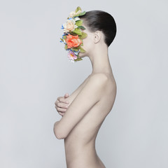 Nude elegant lady with flower-mask