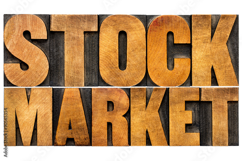 stock market text in wood type