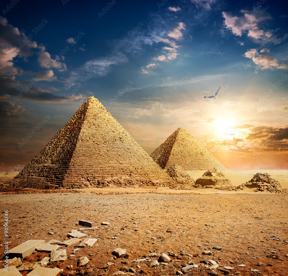 Naklejka premium Sunset over pyramids