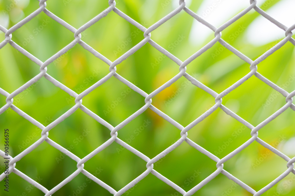 Fototapeta premium mesh fence closeup on blur backgroun