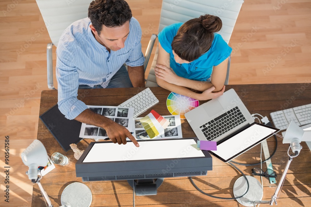 Casual business team working together with computer Casual business team working together with computer