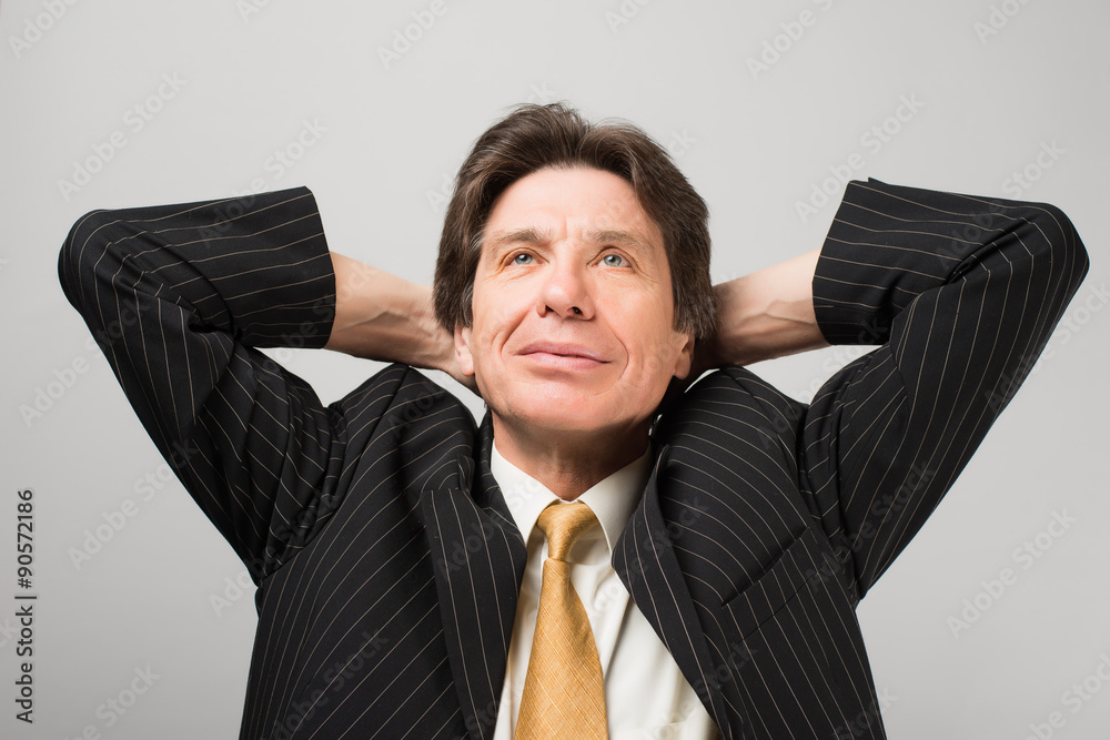 relaxed and dreaming business man sits on office chair relaxed and dreaming business man sits on office chair