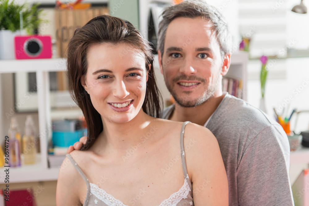 close portrait of a couple looking at the camera at home close portrait of a couple looking at the camera at home