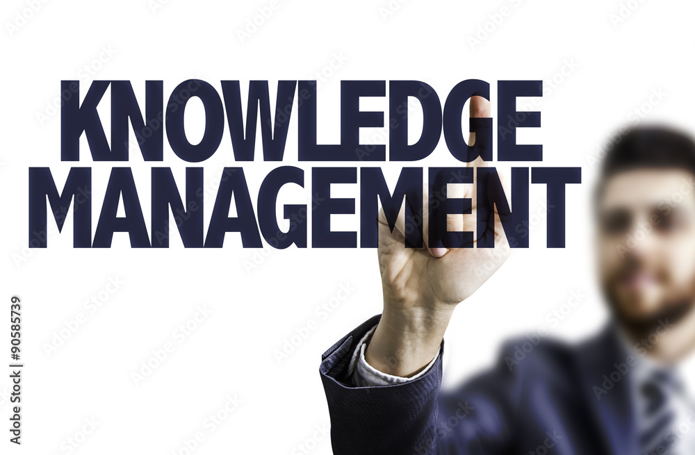 Business man pointing the text: Knowledge Management Business man pointing the text: Knowledge Management