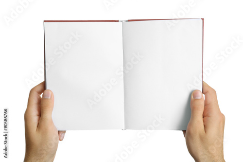 Fototapeta Naklejka Na Ścianę i Meble -  Male hands holding book isolated on white