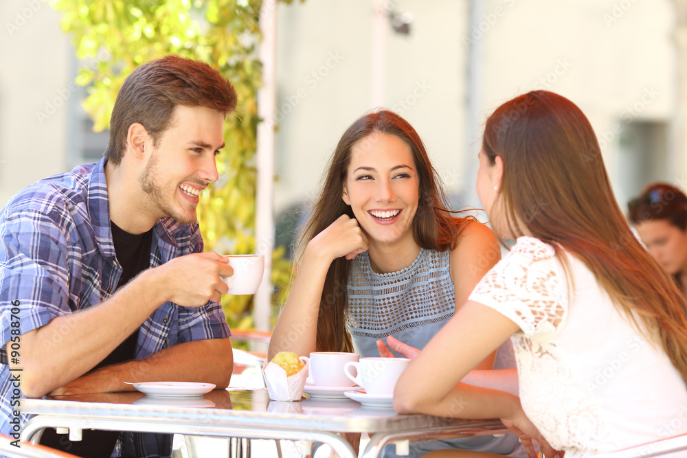 Friends talking in a coffee shop terrace Friends talking in a coffee shop terrace