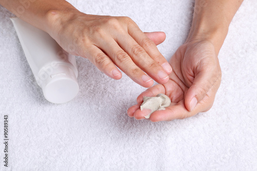 A pair of hands about to spread out some hand cream