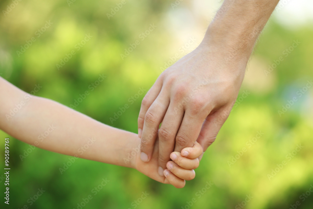 Father and daughter hands outdoors Father and daughter hands outdoors