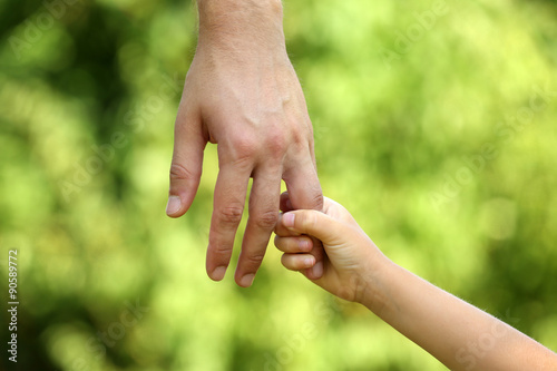 Father and daughter hands outdoors © Africa Studio