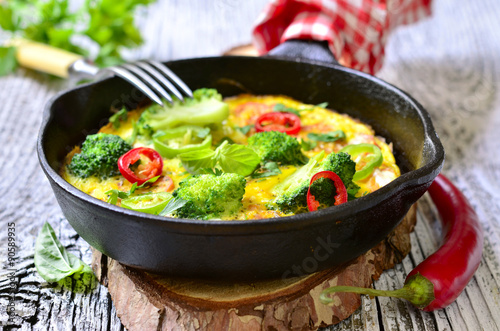 Omelet with tomatoes and broccoli.