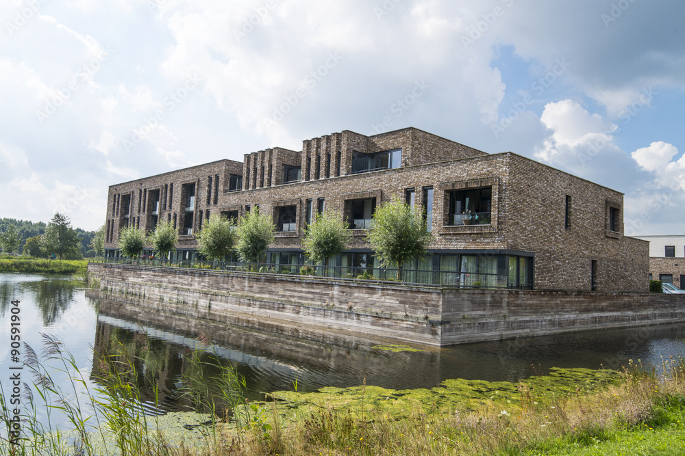 Obraz premium apartment building near water