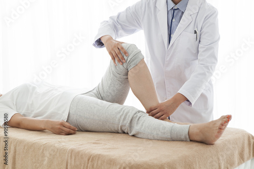 Orthopedic surgeon, has been testing a woman's legs photo