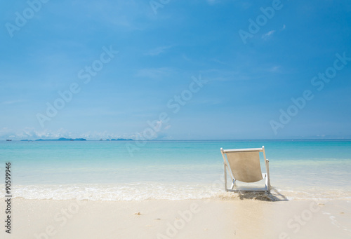 Fototapeta Naklejka Na Ścianę i Meble -  beach chair on beach with blue sky