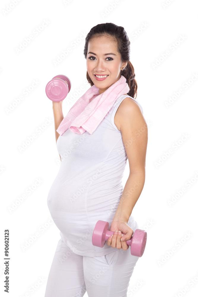 Beautiful asian pregnant woman working out with weights isolated Beautiful asian pregnant woman working out with weights isolated