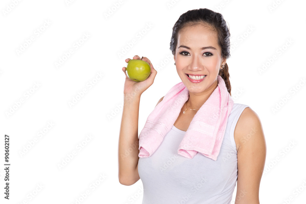 pregnant asian woman holding an apple, smiling to the camera pregnant asian woman holding an apple, smiling to the camera