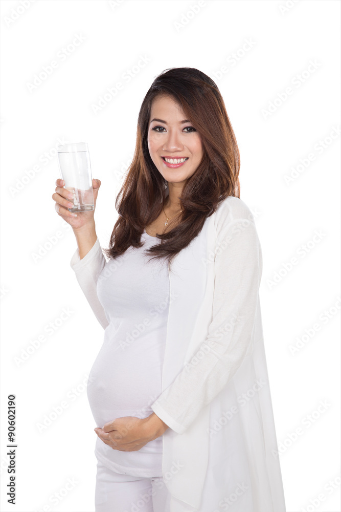 Beautiful pregnant asian woman holding a glass water, smiling Beautiful pregnant asian woman holding a glass water, smiling