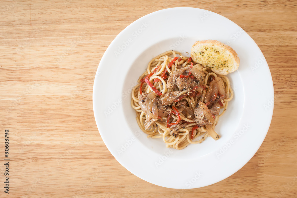 Spaghetti, spicy chicken.on wood table Spaghetti, spicy chicken.on wood table