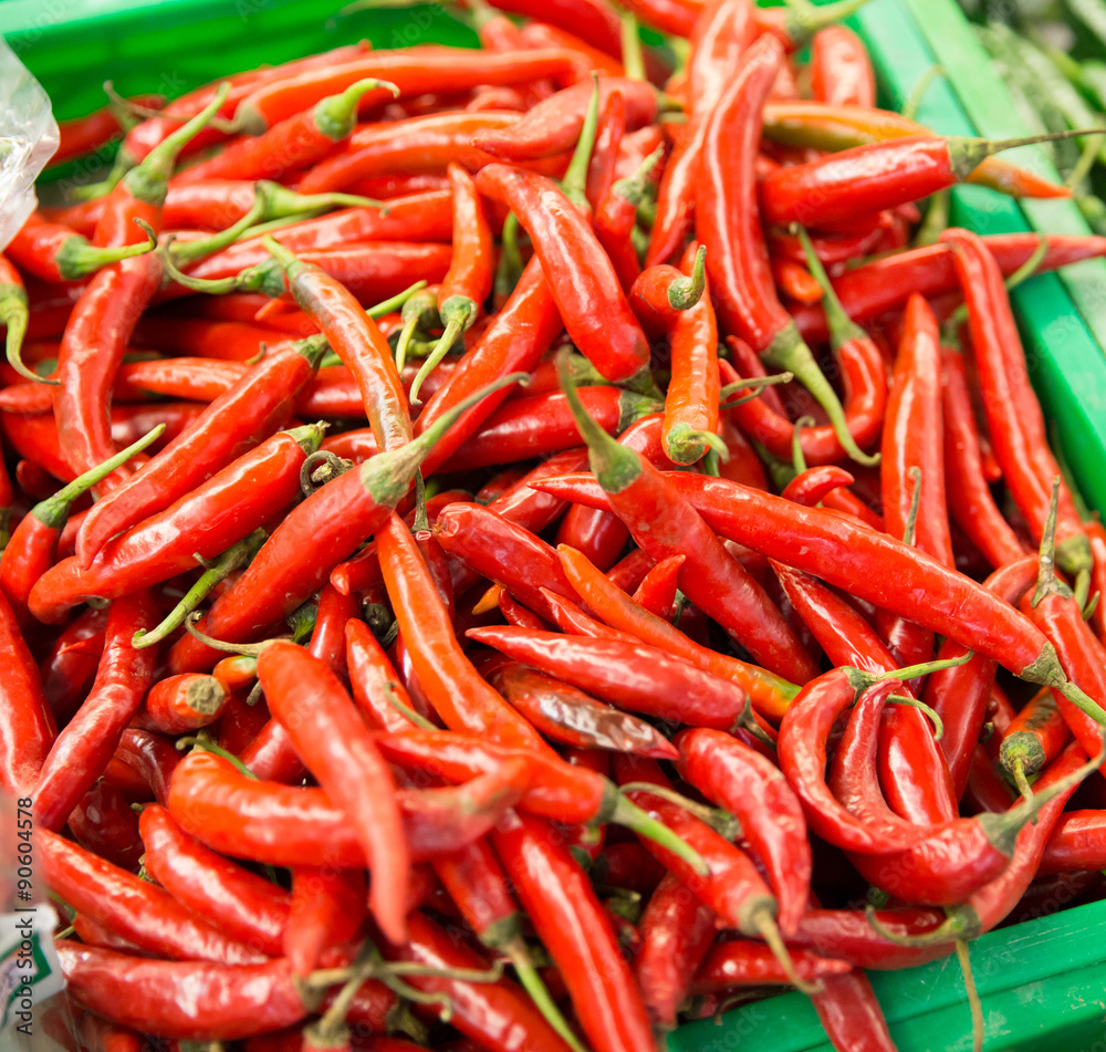 Red chilli pepper on the stall in the market, asian herbs
