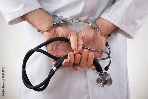 Doctor Hands In Handcuffs photo