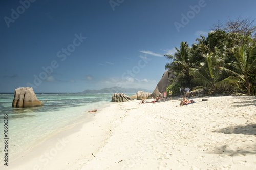 Paradise beach of Seychelles in la Digue island, Anse Source d'Argent. Boulders black granite rocks, tropical vegetation, turquoise water, white sand and blue sky. © albertraso