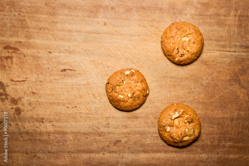 Oatmeal cookies with wooden background.