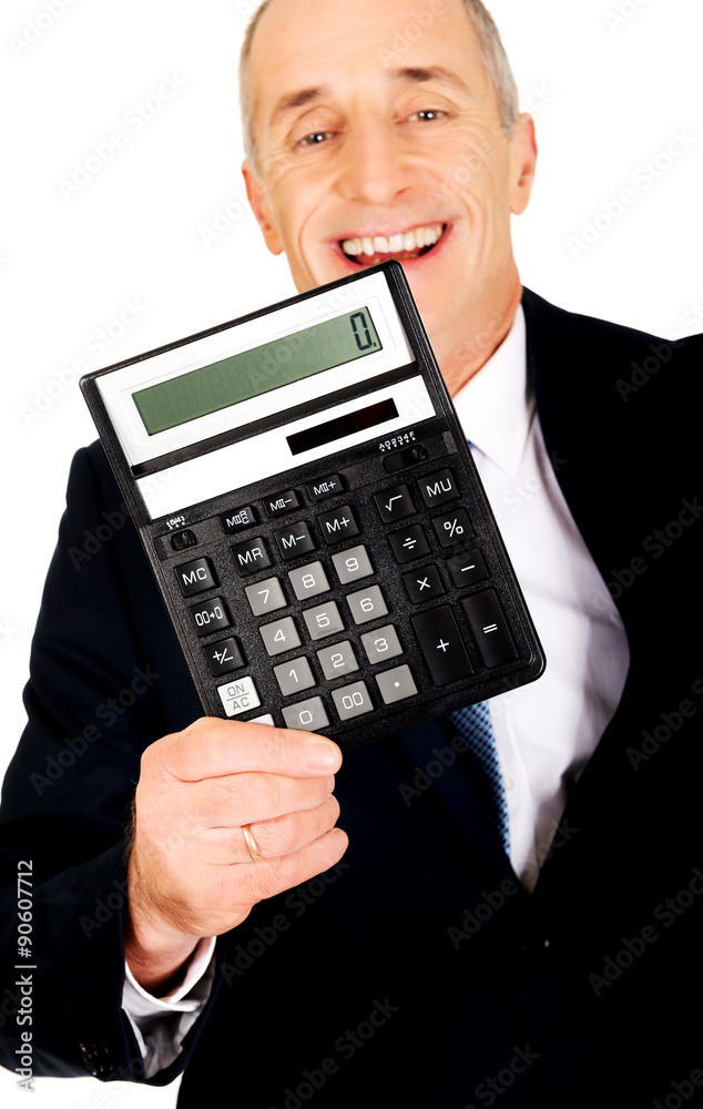 Happy businessman holding a calculator Happy businessman holding a calculator