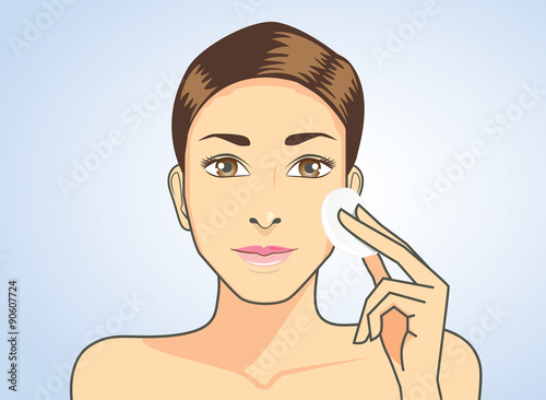 Beautiful woman cleaning face skin with facial cotton