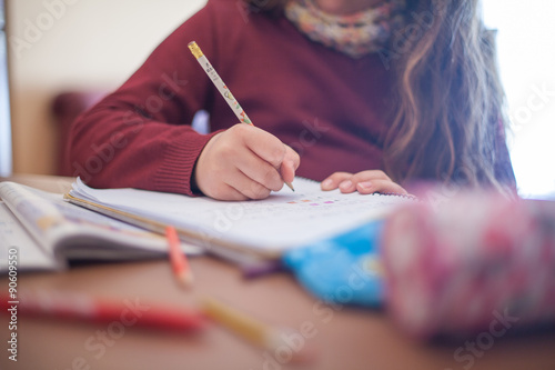 Little girl doing homework photo