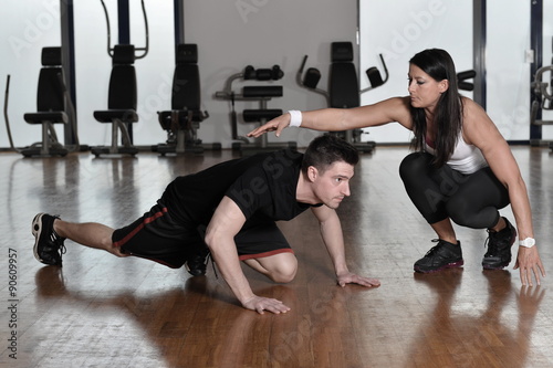 Female personal trainer working with her trainee