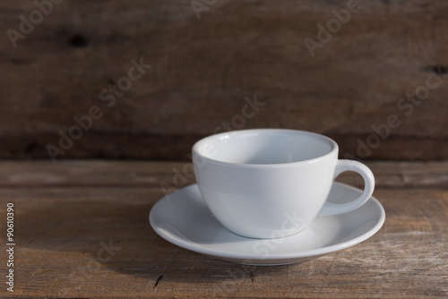 Cup of coffee on grunge wood table in vintage style,still life