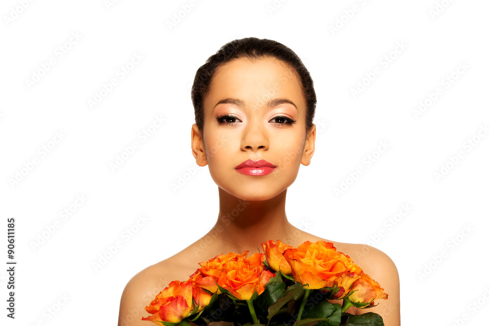 Fototapeta premium Beauty african woman with roses.