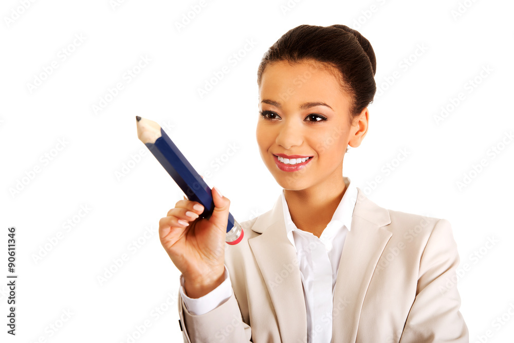 Businesswoman pointing with big pencil. Businesswoman pointing with big pencil.