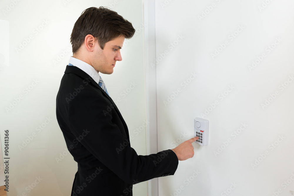 Businessman Using Door Security System Businessman Using Door Security System