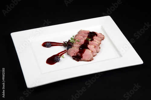 duck meat with cranberry cream photo