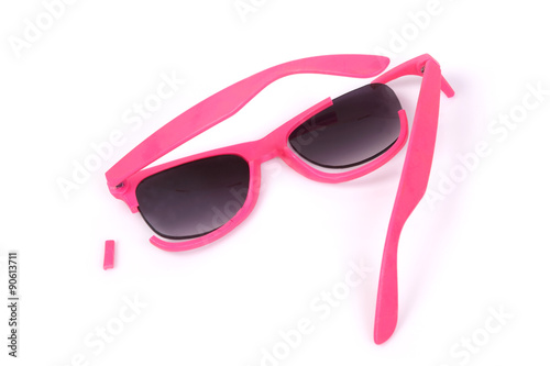 Broken pink sunglasses.